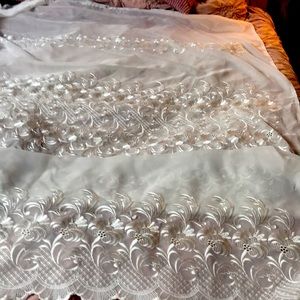 Sheer curtains. 54 x 84. Scalloped bottoms. Ivory colored.